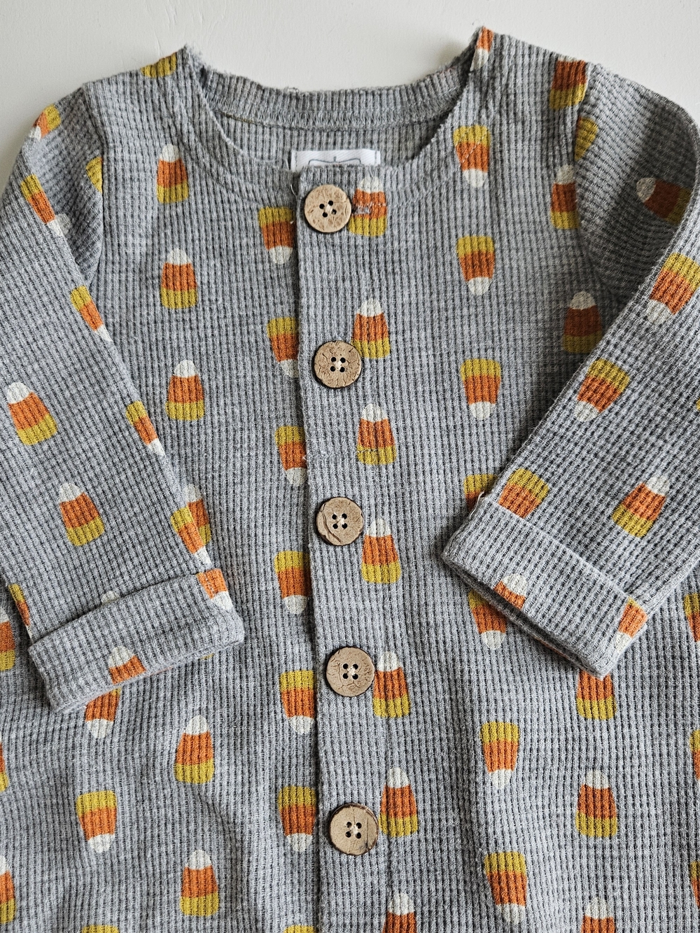 Mud Pie Gray Waffle-Knit Candy Corn One-Piece with Orange and Yellow Print